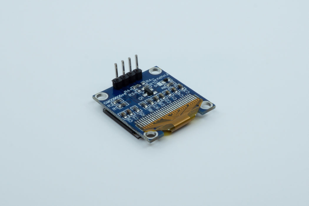 An bottom view of a blue 128 by 64 pixel SSD1306 OLED display.