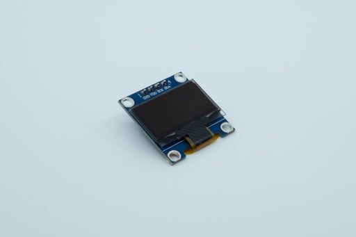 An angled top view of a blue 128 by 64 pixel SSD1306 OLED display.