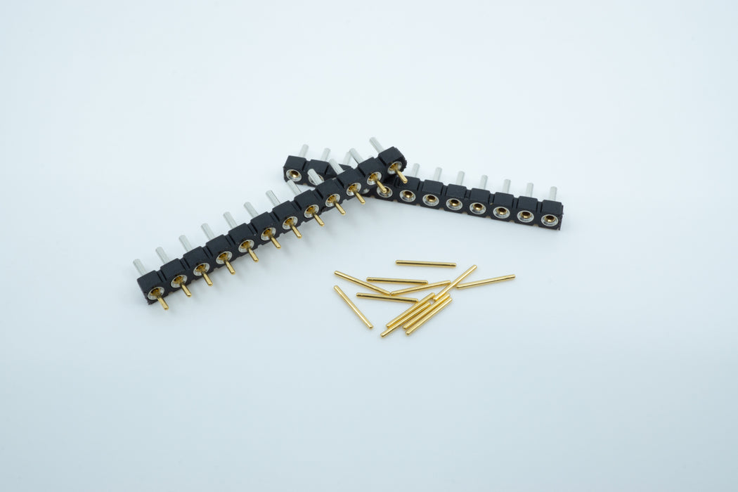 Two rows of Mill Max low profile sockets, with one row filled with gold plates pins.