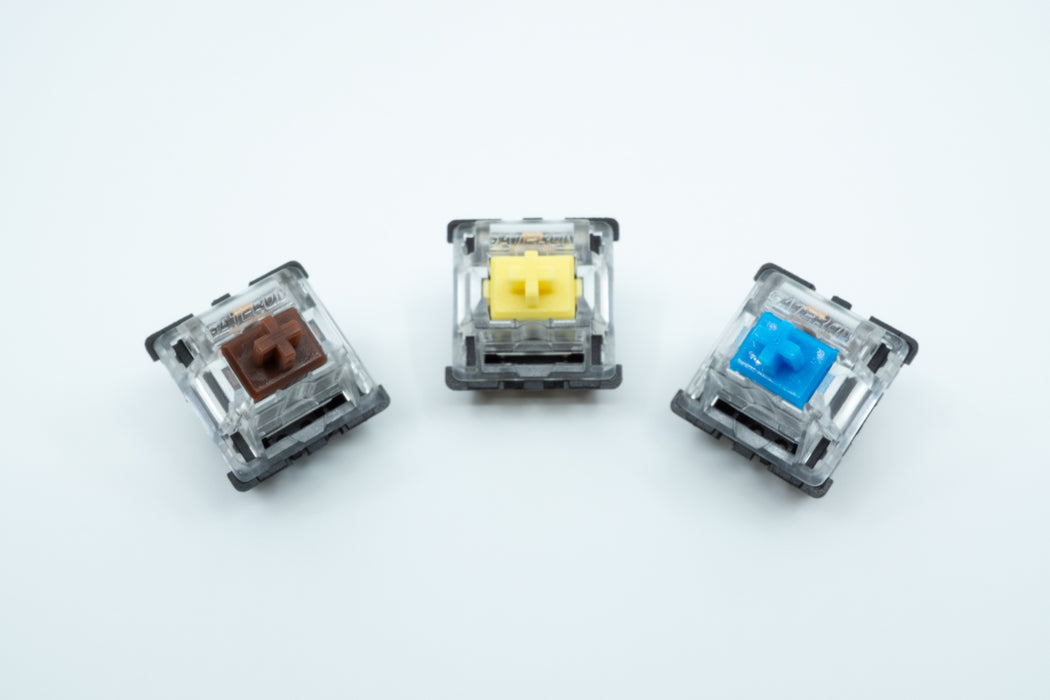 A Gateron Brown, Gateron Yellow and Gateron Blue switch next to each other.