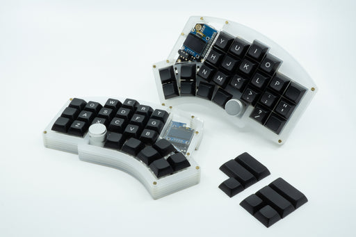 A Kyria keyboard showcasing black DSA keycaps, with legends for the alpha keys.