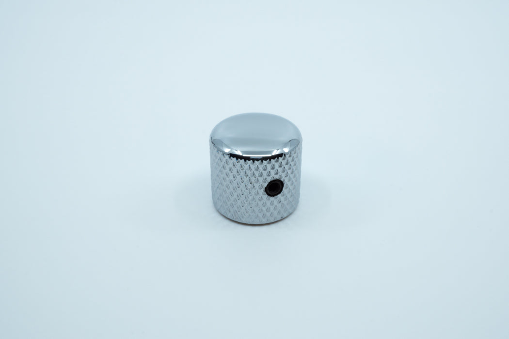 A photo showing the side of the shiny knurled metal encoder knob.
