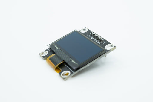 An angled top view of a black 128 by 64 pixel SSD1306 OLED display.